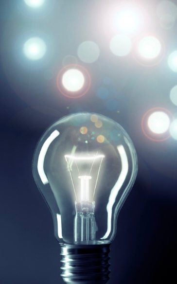 Light bulb with glowing stars. 